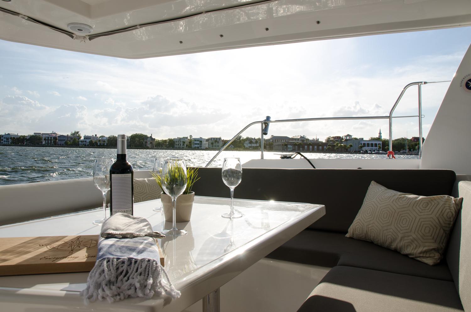 Enjoy a glass with friends on your Charleston catamaran charter.