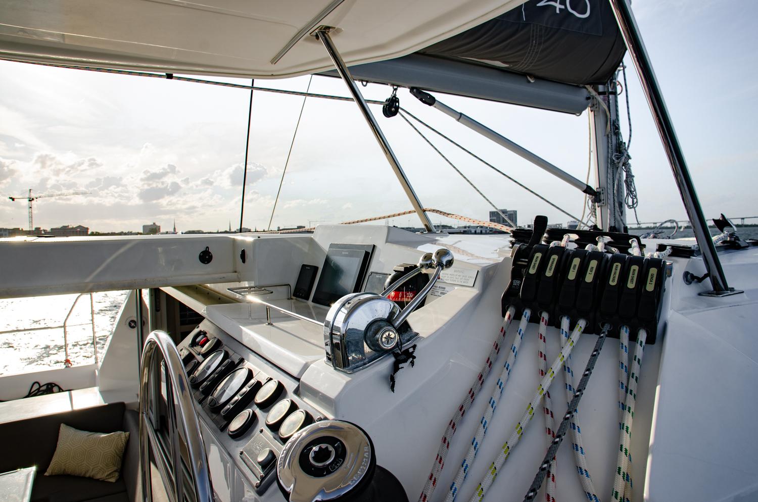 Visit the helm to learn how to navigate our private catamaran through Charleston Harbor.